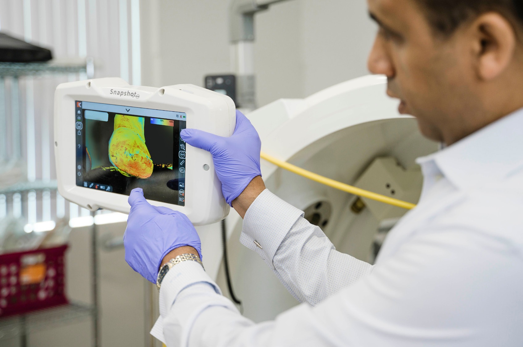 Dr. Alonso reviewing a near-infrared tissue oxygenation image of a patient's foot