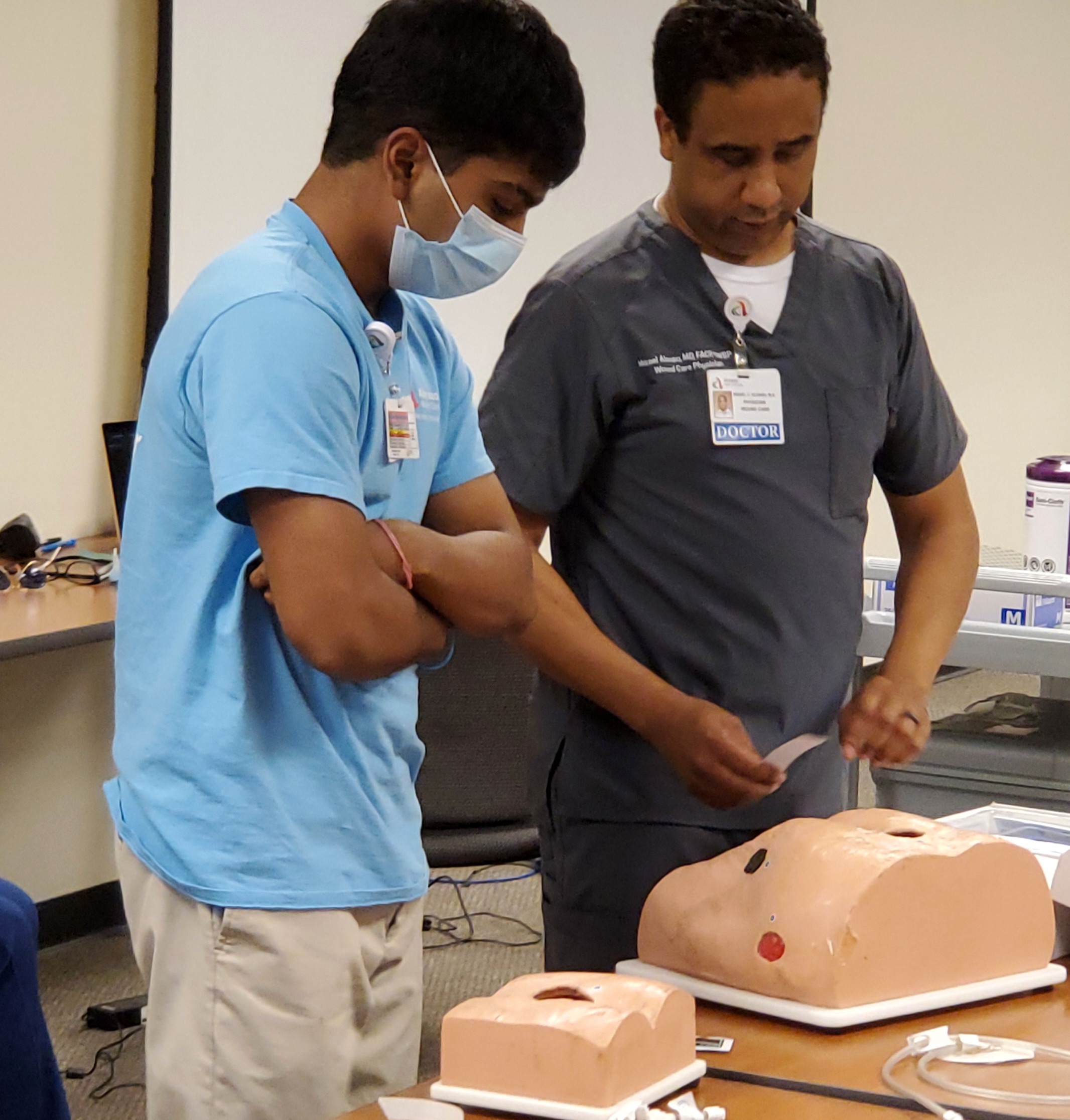 Dr. Alonso going through wound care supplies with a student ambassador at Abrazo West Campus